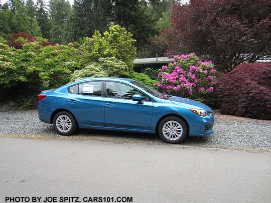 2017 Subaru Impreza 4 door sedan Premium. Silver 16" alloy wheels, body colored door handles and mirrors.  Island blue color shown.