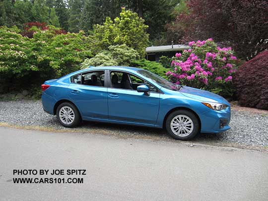 2017 Subaru Impreza 4 door sedan Premium. Silver 16" alloy wheels, body colored mirrors, no trunk spoiler.  Island blue color shown.