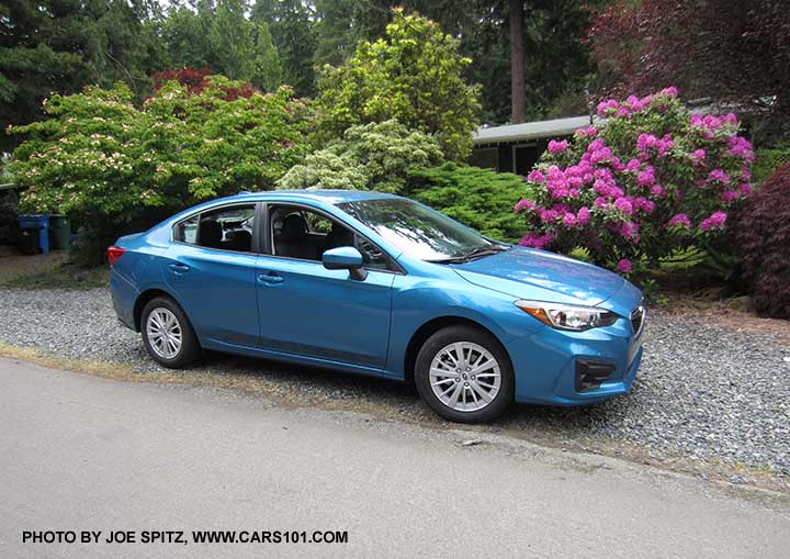 2017 Subaru Impreza 4 door sedan Premium. Silver 16" alloy wheels, body colored door handles and mirrors.  Island blue color shown.