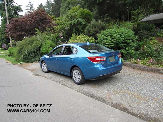 2017 Subaru Impreza 4 door sedan Premium. Silver 16" alloy wheels, body colored door handles, no trunk spoiler.  Island blue color shown.