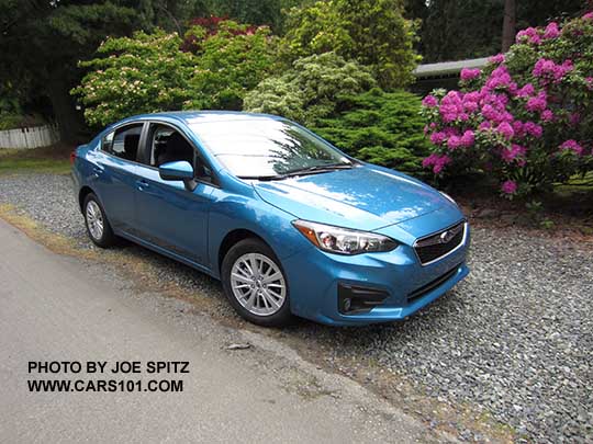 2017 Subaru Impreza 4 door sedan Premium. Silver 16" alloy wheels, body colored door handles and mirrors.  Island blue color shown.