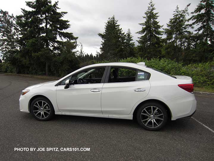 2017 Subaru Impreza Limited 4 door sedan has 17" machined alloys, chromed door handles, body colored outside mirrors with turn signals. Crystal white shown.