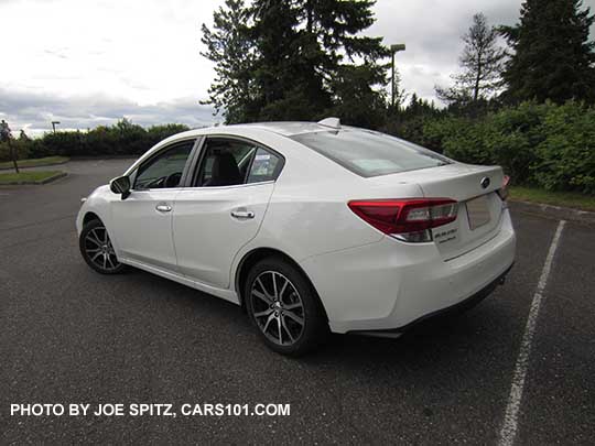 2017 Subaru Impreza Limited 4 door sedan has 17" machined alloys, chromed door handles Crystal white shown.