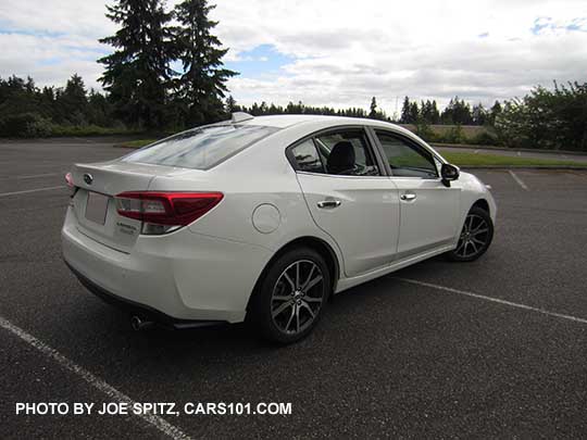 2017 Subaru Impreza Limited 4 door sedan, 17" machined alloy, silver door handles, Crystal white shown.