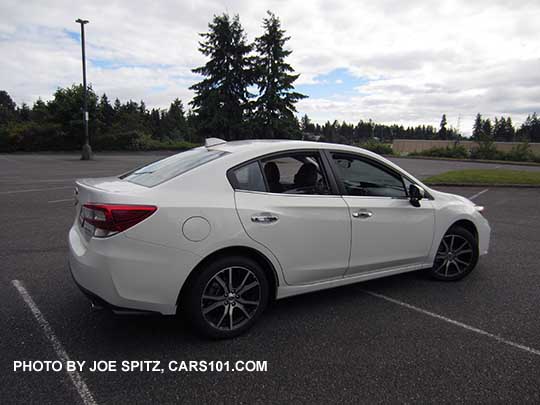 2017 Subaru Impreza Limited 4 door sedan, 17" machined alloy, silver door handles, Crystal white shown.