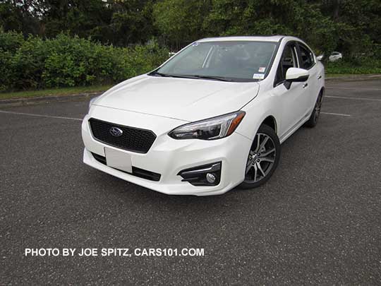 2017 Subaru Impreza Limited 4 door sedan has chrome fog light accents, 17" machined alloys. Shown with option Sport mesh grill.