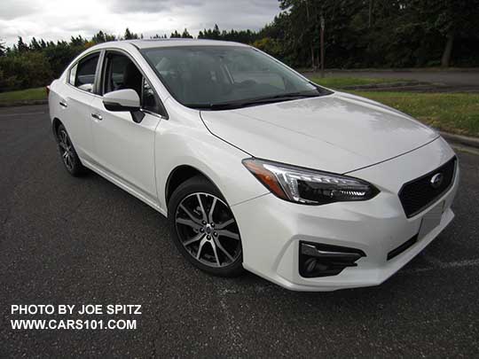2017 Subaru Impreza Limited body colored outside mirror with turn signal, and chrome lower window trim and door handles. Optional Sport mesh front grill