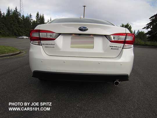 rear view 2017 Subaru Impreza Limited 4 door sedan with reverse auto brake sensors and stainless exhaust tip.