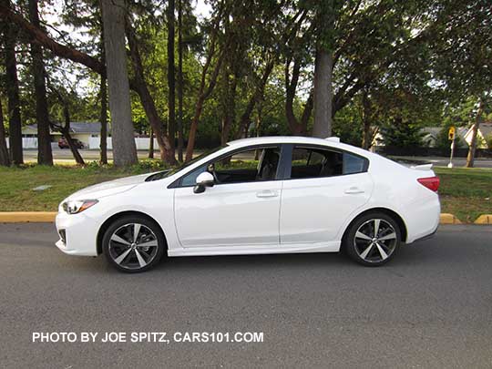 2017 Subaru Impreza Sport 4 door sedan has 18" machined alloys, body colored mirrors with turn signals, rear spoiler with black body.