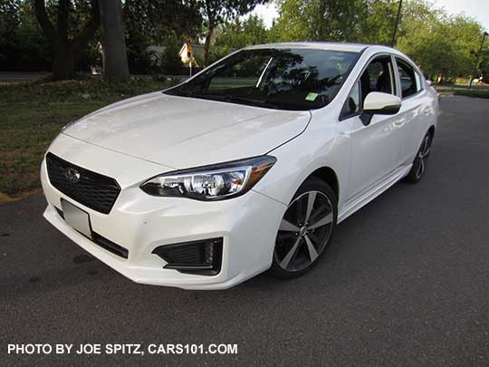 2017 Subaru Impreza Sport 4 door sedan has 18" machined alloys, black front grill accent bar with center logo, body colored mirrors with turn signals, LED daytime running lights (no fog lights)