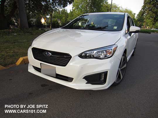 2017 Subaru Impreza Sport 4 door sedan has 18" machined alloys, black front grill accent bar with center logo, body colored mirrors with turn signals, LED daytime running lights (no fog lights)