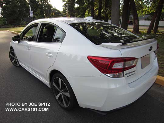 2017 Subaru Impreza Sport 4 door sedan has 18" machined alloys, rear gloss black spoiler with body colored support ends