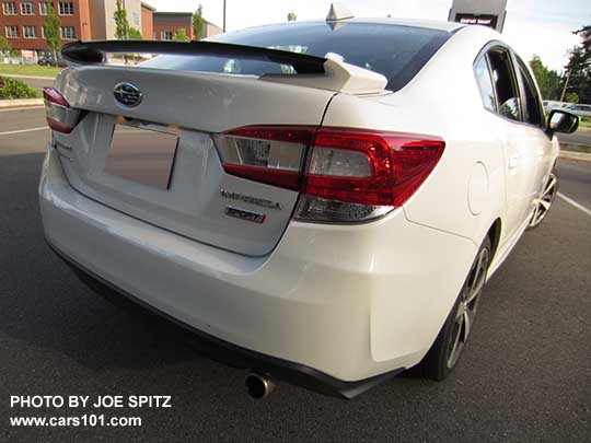 2017 Subaru Impreza Sport 4 door sedan has 18" machined alloys, rear gloss black spoiler with body colored support ends, stainless exhaust tip