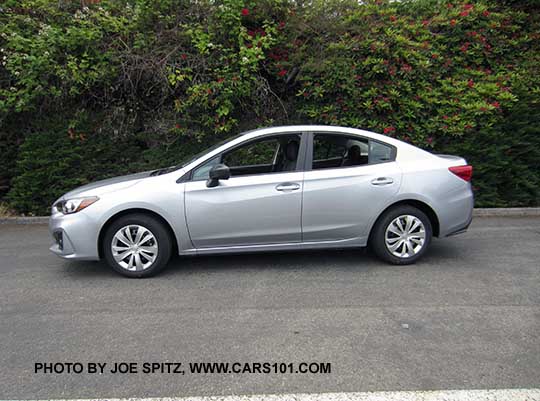 2017 Subaru Impreza 2.0i 4 door sedan, with black outside mirrors, 16" wheels with plastic wheel covers. Ice silver shown.