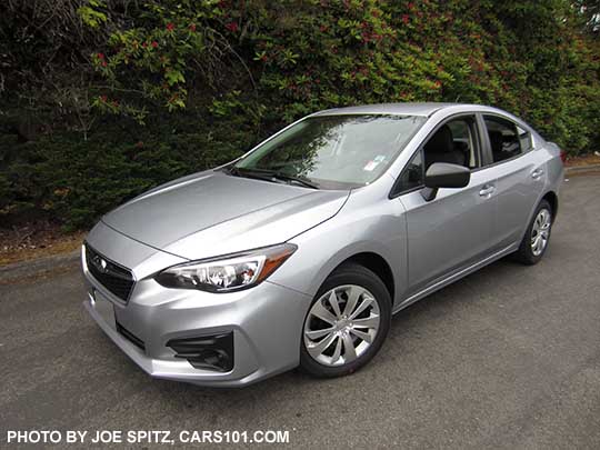 2017 Subaru Impreza 2.0i 4 door sedan, with black outside mirrors, 16" wheels with plastic wheel covers, no fog lights. Ice silver shown.