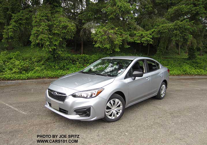 2017 Subaru Impreza 2.0i 4 door sedan, base model with black outside mirrors, 16" wheels with plastic wheel covers, no fog lights.. Ice silver shown.