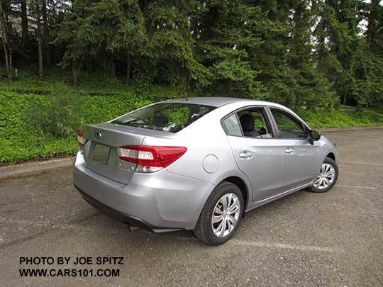 2017 Subaru Impreza 2.0i 4 door sedan, with black outside mirrors, 16" wheels with plastic wheel covers. Ice silver shown.