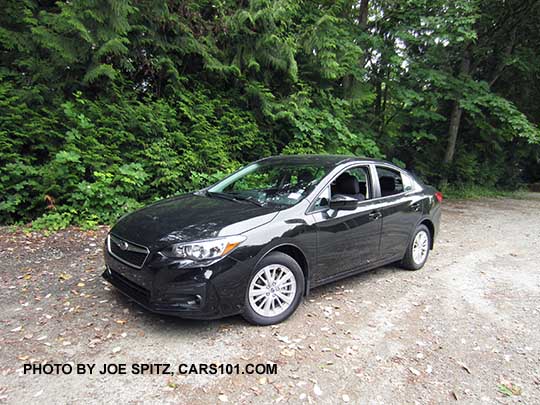 2017 Subaru Impreza Premium 4 door sedan, silver alloy wheels, crystal black color shown.