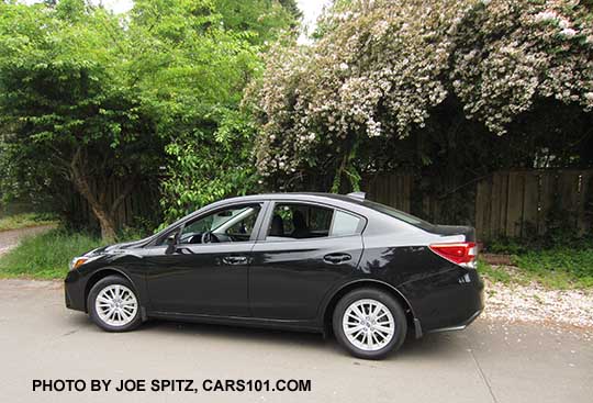 2017 Subaru Impreza Premium 4 door sedan, silver alloy wheels, crystal black color shown.