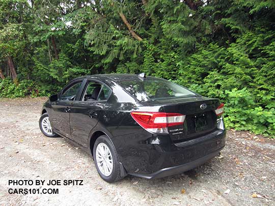 2017 Subaru Impreza Premium 4 door sedan, silver alloy wheels, crystal black color shown.