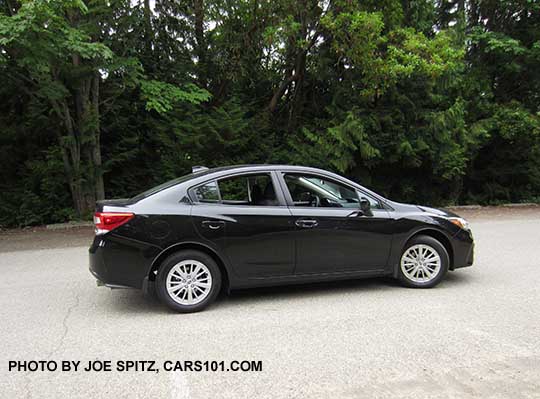 2017 Subaru Impreza Premium 4 door sedan, silver alloy wheels, crystal black color shown.