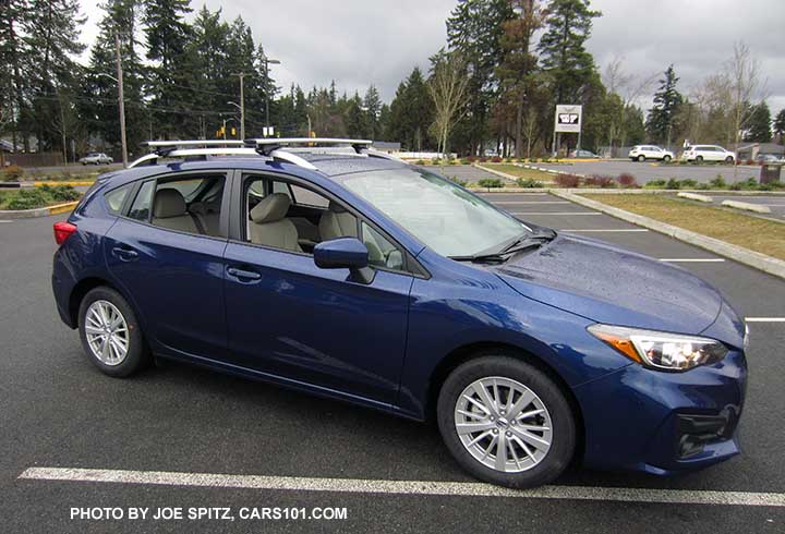 2017 Subaru Impreza Premium 5 door hatchback, 16" silver alloys,  silver roof rack rails with optional Thule cross bars. Lapis blue car.