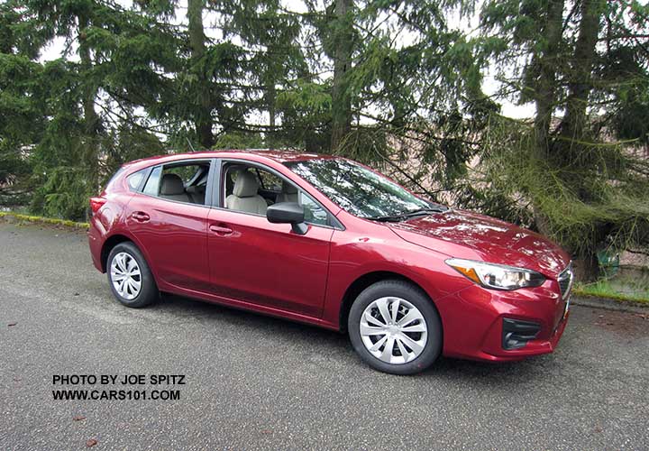 2107 venetian red Subaru Impreza 2.0i 5 door hatchback with 16" steel wheels with plastic wheel covers, black unpainted mirrors,