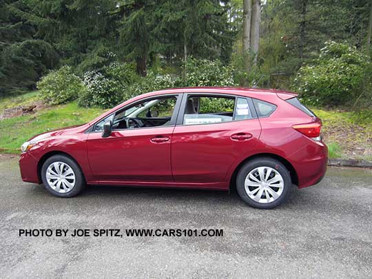 profile view 2017 Subaru Impreza 2.0i 5 door, venetian red color.  Steel wheels with plastic wheel covers.