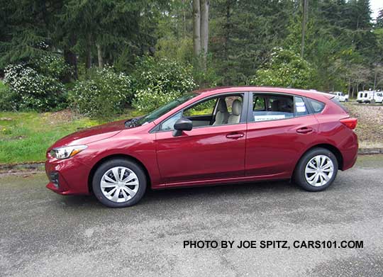 2017 Subaru Impreza 2.0i 5 door hatchback.  Steel wheels with plastic wheel covers.  venetian red color