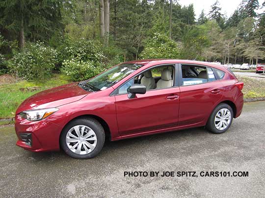 2017 Subaru Impreza 2.0i 5 door, venetian red color. Steel wheels with plastic wheel covers.