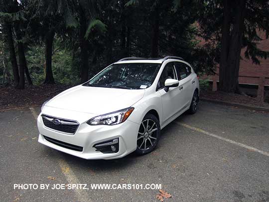 2017 Subaru Impreza Limited 5 door hatchback,17" alloys and silver roof rails. Crystal White.