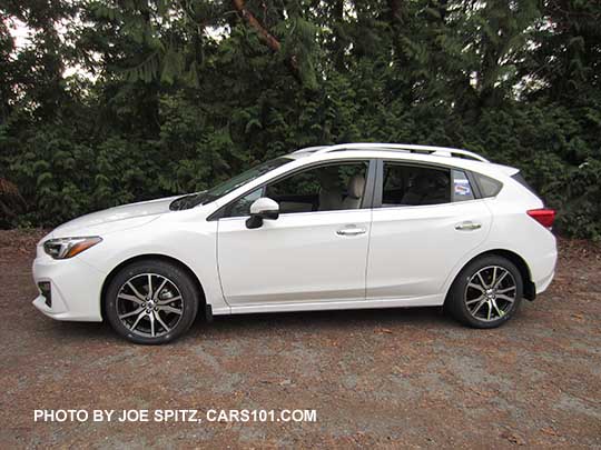 2017 Subaru Impreza Limited 5 door hatchback, 17" alloys,  silver door handles,  roof rails. Crystal White.