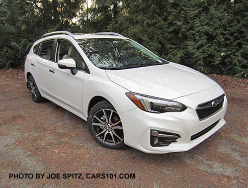 2017 Subaru Impreza Limited 5 door hatchback, 17" alloys, silver roof rack rails and fog light trim. Crystal White