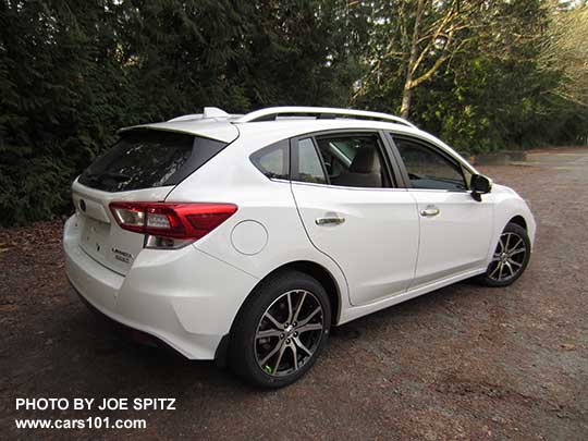 2017 Subaru Impreza Limited 5 door hatchback, 17" alloys, silver roof rack rails and fog light trim. Crystal White