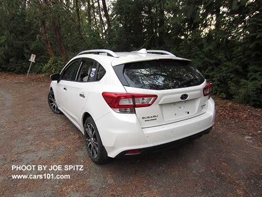 2017 Subaru Impreza Limited 5 door hatchback, 17" alloys, silver roof rack rails. Notice the small reverse auto brake sensors in the rear bumper.