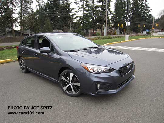 side view 2017 Subaru Impreza Sport 5 door hatchback, 18" alloys, daytime LED running lights on Carbide Gray Metallic color shown.