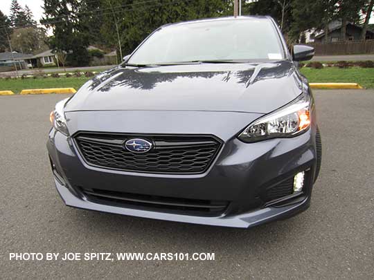 front view 2017 Subaru Impreza Sport, LED daytime running lights (DRLs) on. Carbide gray car.