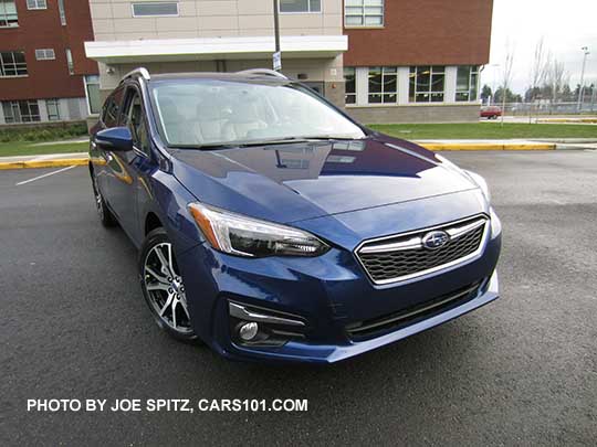 2017 Subaru Impreza Limited 5 door hatchback, Lapis Blue color.  17" machined alloys, silver roof rack rails and fog light trim