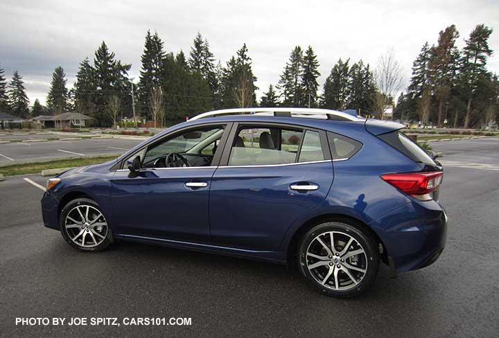 2017 Subaru Impreza Limited 5 door hatchback. 17" machines alloys, silver door handles and roof rack rails. Lapis Blue color shown.