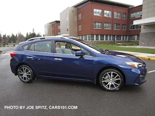 2017 Subaru Impreza Limited 5 door hatchback has silver roof rack rails, silver door handles, silver fog light trim.  17" machined alloys. Lapis blue color.