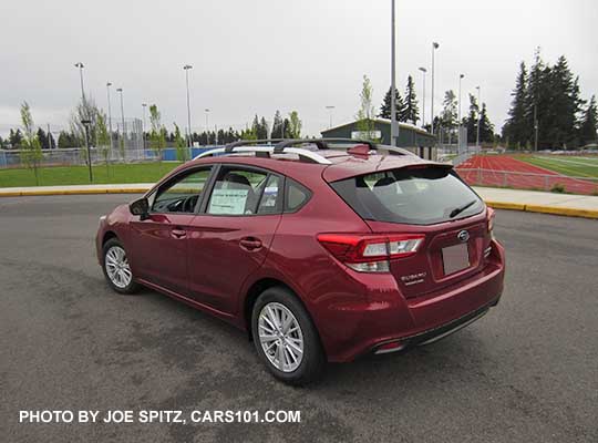 2017 Subaru Impreza Premium 5 door hatchback, 16" silver alloys, silver roof rack rails. Venetian Red car shown