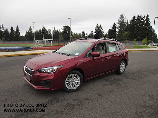 2017 Subaru Impreza Premium 5 door hatchback, 16" silver alloys, silver roof rack rails with optional aero cross bars. Venetian Red car shown