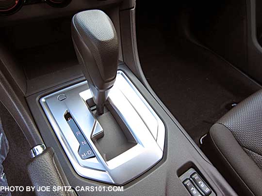 2017 Subaru Impreza Premium CVT vinyl shift handle with D drive and M manual paddle shift modes, silver shift surround. Showing the heated seat buttons.