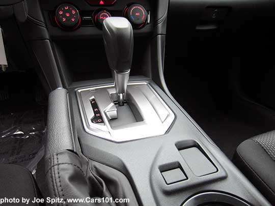 2017 Subaru Impreza 2.0i base model center console with vinyl shift knob, silver shift surround, CVT Drive and Low models only. Blank spot where the heated seat buttons are on all other models.