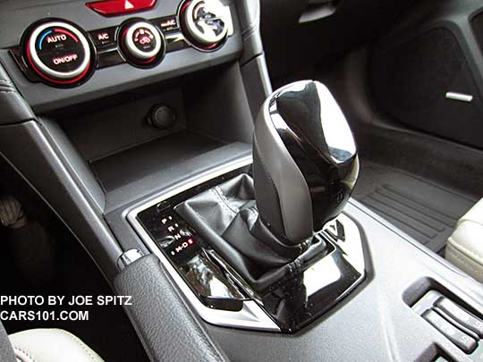 2017 Subaru Impreza Limited CVT gloss black shift knob and shift surround. Automatic climate control buttons.