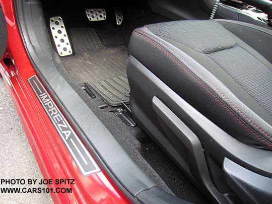 2017 Subaru Impreza optional door sill plates. Set of 4.  Driver door shown, also with optional all weather floor mats. Lithium Red Sport model with metal pedal covers shown.
