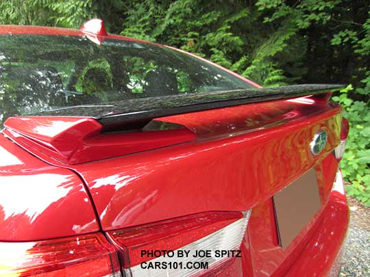 2017 Subaru Impreza Sport 4 door sedan rear trunk spoiler with body colored ends and gloss black body. Lithium red pearl shown.