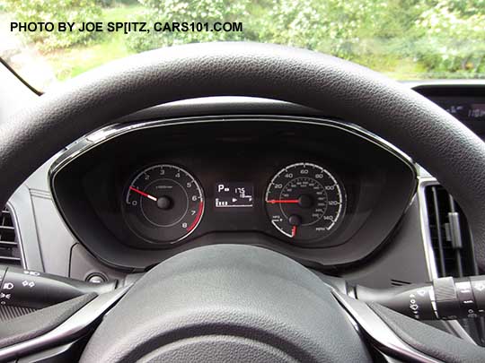 2017 Subaru Impreza 2.0i and Premium vinyl wrapped steering wheel.  No paddle shifters so, this is either a 2.0i manual or CVT