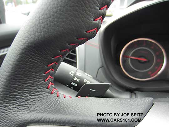 closeup of the 2017 Subaru Impreza Sport red stitching on the leather wrapped steering wheel.