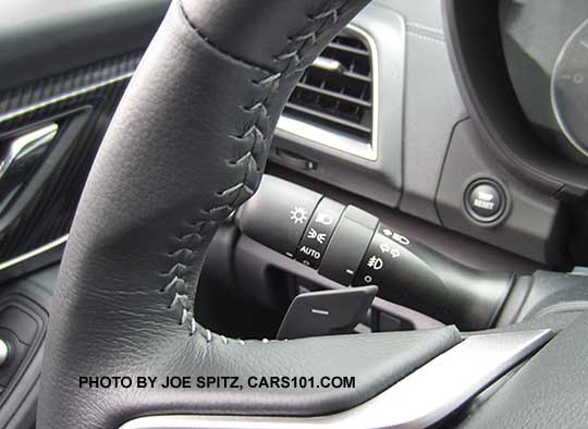 closeup of the 2017 Subaru Impreza Limited silver stitching on the leather wrapped steering wheel